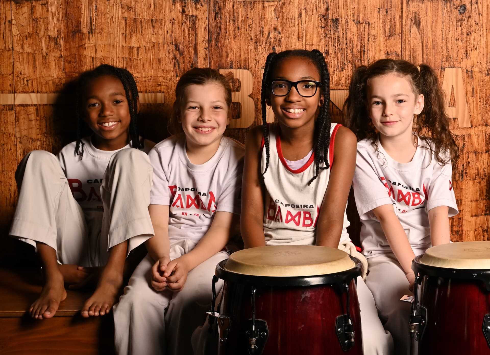 Young Capoeira students with drums in the Little Warriors program